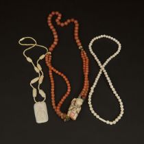 Three Ivory and Carnelian Beaded Necklaces, 牙雕及玛瑙珠串一组三件, longest length 15.9 in — 40.5 cm (3 Pieces)