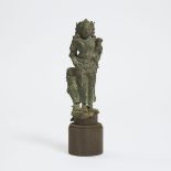 A Bronze Figure of a Mother Goddess, Java, 14th Century, including stand height 11.4 in — 29 cm