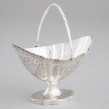 George III Silver Bright-Cut Shaped Oval Sugar Basket, Henry Chawner, London, 1786, height 6.3 in —