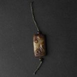 A Celadon and Russet 'Chilong' Tubular Pendant, Ming Dynasty (1368-1644), 明 青玉提油'螭龙'谷纹勒, 1.7 x 0.9 i