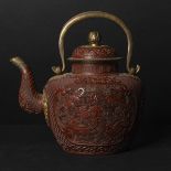 A Red Lacquer 'Twin-Lion' Teapot with Gilt Copper Fittings, 19th Century, 清 十九世纪 狮纹铜胎剔红提梁壶, includin