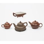 Three Yixing/Zisha Teapots and a 'Yí' Cup, 20th Century, 民国及更晚 宜兴紫砂匜及茶壶一组四件, largest height 2.8 in —