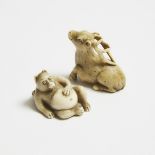 An Ivory Netsuke of a Tanuki and a Deer, Signed Hidekazu, Meiji-Showa Period (1868-1989), largest 1.