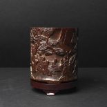 A Carved Bamboo 'Scholars' Brush Pot, 19th Century, 清 十九世纪 竹雕高仕图笔筒, height 6.3 in — 16 cm, diameter