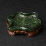 A Spinach Jade Lotus-Form Washer, 19th Century, 清 十九世纪 碧玉雕荷叶洗, length 3.5 in — 9 cm