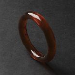 A Rare Natural Amber Bangle, 19th Century, 清 罕见天然棕红琥珀镯, diameter 3.2 in — 8.2 cm