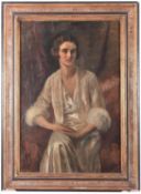 A 1920s oil painting on canvas. Portrait of a young woman. Unsigned in a gilt and painted frame.