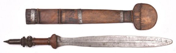 An African Yaka sword, leaf shaped blade 17" with simple two line punched decoration, the hilt
