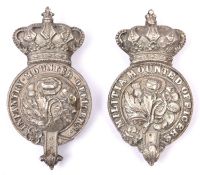 A Victorian white metal martingale badge for Infantry Mounted Officers; and a similar white metal