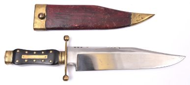 A Bowie knife, broad clipped back blade 9½" stamped with Wostenholm markings, eagle, "I*XL", etc;