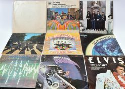 9x LP records. Including The Beatles; The White Album, Magical Mystery Tour, Abbey Road and Hey
