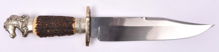 A Bowie knife, broad clipped back blade 9¾" stamped with Wostenholm type eagle, "THE HUNTERS