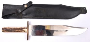A large Bowie knife, broad clipped back blade 12", the ricasso stamped "K MOOREY, SHEFFIELD,