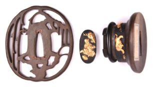 A Higo style tsuba of openwork tree design; and Fuchi with golden tiger and chrysanthemums, kashira
