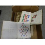 A collection of used world stamps in 2 albums and a quantity loose in envelopes etc. Together with a