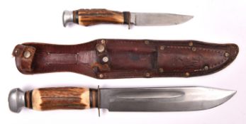 A large German hunting knife, broad blade 8", by Baron, Solingen, with staghorn grip, in its leather