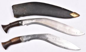 A kukri, blade 13½", with steel mounted plain wooden hilt, in its leather covered sheath with
