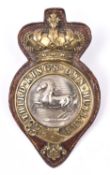 A Victorian martingale badge of the 3rd King's Own Hussars, with Guelphic crown and original leather