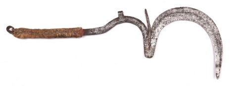 An African Matakam throwing knife "Sengese", 22" overall, the elaborate blade decorated with punched