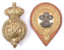 A gilt and silver ear boss of the Earl of Chester's Yeomanry Cavalry, on leather backing, and a