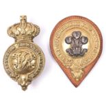 A gilt and silver ear boss of the Earl of Chester's Yeomanry Cavalry, on leather backing, and a