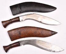 2 kukris, with plain wood hilts, in their leather covered sheaths. GC £40-50