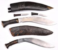 A kukri, with brass mounted horn hilt, in its leather covered sheath with belt loops and two