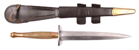 A second pattern FS fighting knife, with plain blade, brass hilt and steel cross guard, in its