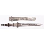 A North African knife, tapered double edged blade 7½" with central fullers, in its sheath, the