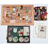 A quantity of WWI 'Flag Day' flags and collectors' badges, including a glazed mahogany display case,