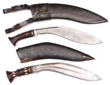 A kukri, with riveted wood grips, the blade stamped "M" over "43", in its black leather covered