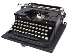 A 1930s Royal portable typewriter. In black finish with a cloth covered wooden case. QGC-GC for age,