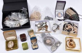 A collection of costume jewellery, silver bangles, silver watch case, etc. Ring boxes. Lady's