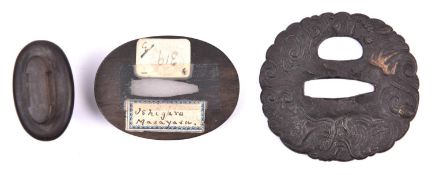 A cast iron tsuba depicting a dragon, GC £50-70