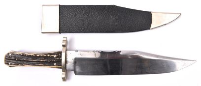 A Bowie knife, broad clipped back blade 9½" stamped with Wostenholm markings, eagle, etc "I*XL" on