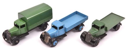 3 Dinky Toys 25 series type 4 Wagons. A Covered Wagon (25b) in dark green with tin tilt, black