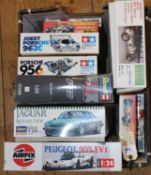 14x unmade plastic kits by Tamiya, Airfix, Revell, etc. All motor racing related. Including; 1:24