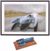 A white metal model of the 1964 Donald Campbell's Bluebird K7 world water speed record boat (