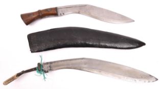 A kukri, the blade stamped with a broad arrow and "INDIA", with rivetted wood grips, no sheath;