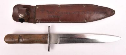 A WWI Turkish trench dagger, hilt slightly chipped, blade re-polished, incorrect sheath. GC £30-50