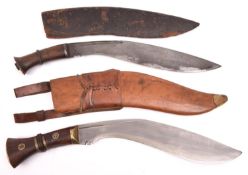 A kukri, the blade spuriously marked with broad arrow over "I", "1917", etc, in its leather