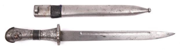 A Tibetan dagger, blade 11½" with narrow fullers, pierced and engraved steel guard and coral stud,