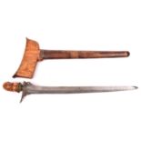 A Malay kris, straight blade 14½", brass mounted carved wood and horn hilt, in its wood sheath, (
