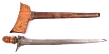 A Malay kris, straight blade 14½", brass mounted carved wood and horn hilt, in its wood sheath, (