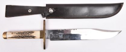 A Bowie knife, clipped back blade 10" with partly scalloped back edge, the ricasso marked "