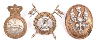 Three Victorian or early Cavalry cap badges: 5th Dragoon Guards, 5th Lancers with lugs, and 14th