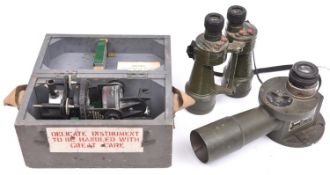 A WWII Astro compass mk II, inspection stamps for 1943 and 1944, in its grey painted transit case. A