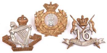 Two Victorian cavalry cap badges: 16th Lancers and 18th Hussars, and a KC 8th Hussars with lugs.