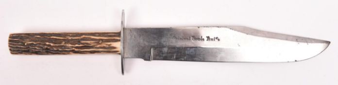 A Bowie knife, clipped back blade 9½", marked in Gothic script "Original Bowie Knife", with oval