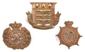 Three Victorian Corps badges: large Army Ordnance Corps pugaree, Army Service Corps, and Royal